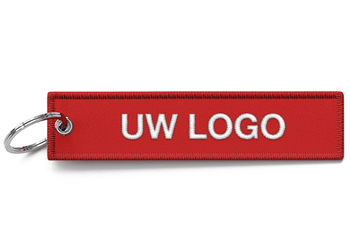 JetTag - Promotionele Stoffen sleutelhangers met gepersonaliseerd logo JetTag - Promotionele Stoffen sleutelhangers met gepersonaliseerd logo